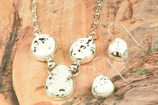 Genuine White Buffalo Turquoise Stones set in Sterling Silver. This Beautiful Stone is formed from the minerals Calcite and Iron. It is mined near Tonopah Nevada. Stunning Necklace and Earrings Set. Created by Navajo Artist Tony Garcia. Signed by the artist.